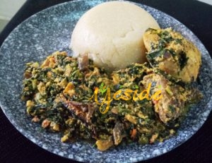 Eba made from white Gari with Egusi and Vegetables