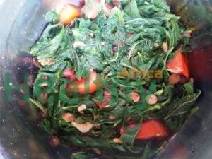 Ewedu, cooked with tomatoes, dried shrimps and locust beans